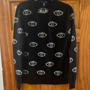 Stylish Black Sweater with Eye Pattern